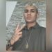 O corpo de Fabian Alves Martins foi retirado da região de mata no Complexo da Penha — Foto: Reprodução